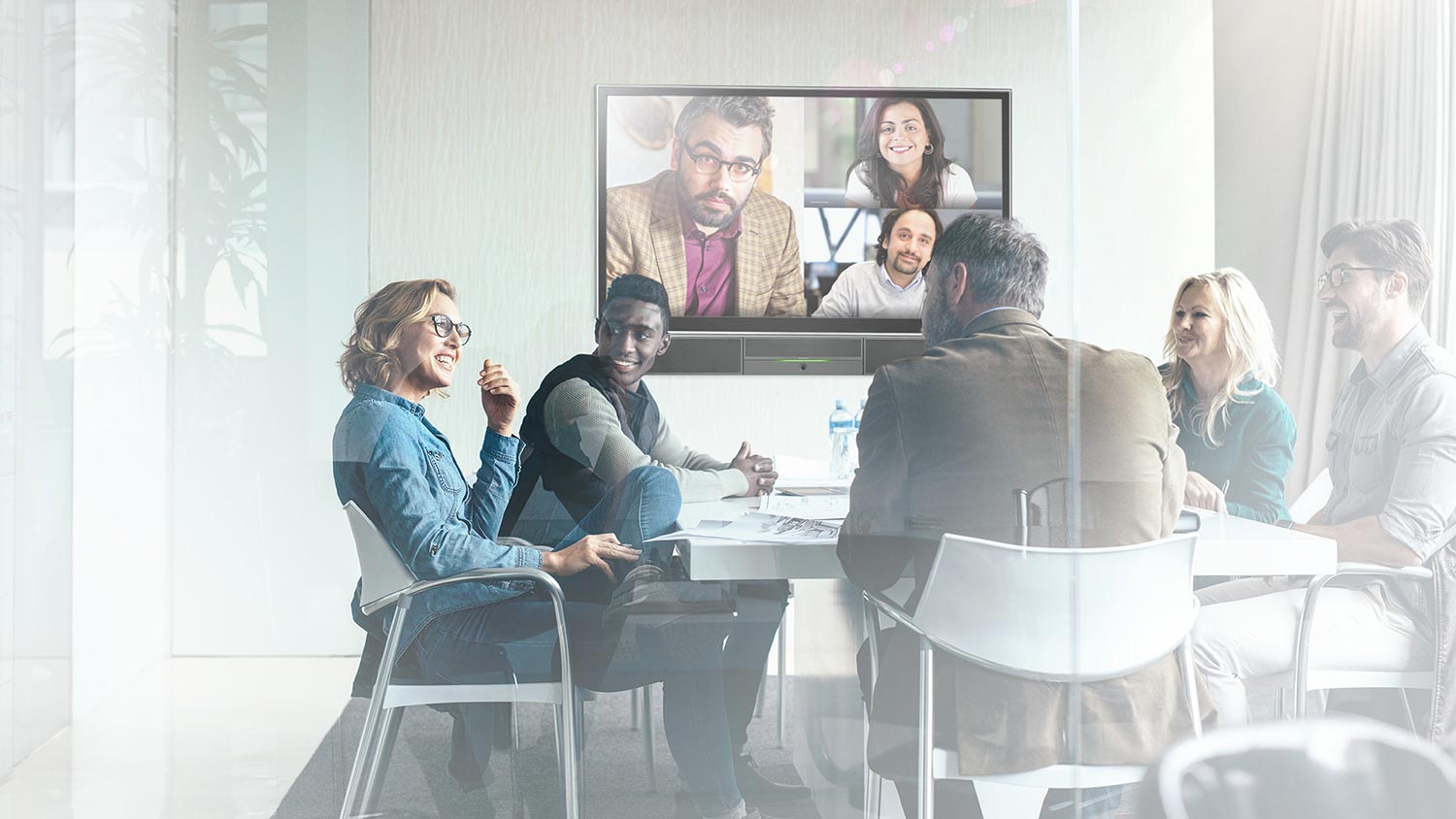 People having a video conference in a meeting room